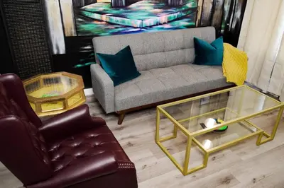 a living room with a couch and a coffee table at Artful Retreat - King Bed, Work Desk, WIFI, Unique Murals, Perfect for Business Travelers, Downtown & Near Universal Studios in Burbank