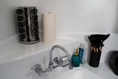 a kitchen sink with a faucet and a counter top at Artful Retreat - King Bed, Work Desk, WIFI, Unique Murals, Perfect for Business Travelers, Downtown & Near Universal Studios in Burbank