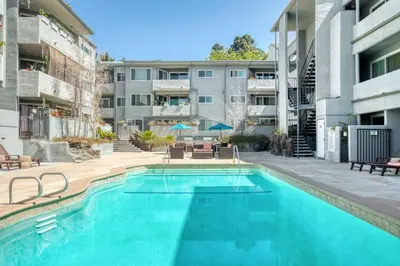 a swimming pool in front of a building at Hollywood 1BR w Pool WD Gym nr Metro LAX-867 in Los Angeles