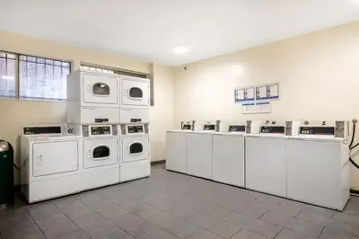 a laundry room with white washers and dryers at Hollywood 1BR w Pool WD Gym nr Metro LAX-867 in Los Angeles