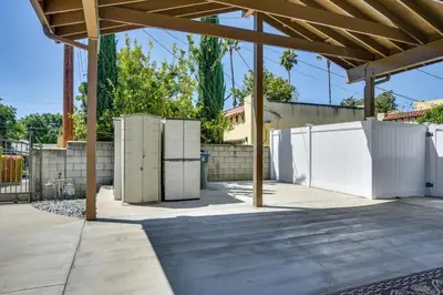 a patio with two refrigerators in a yard at Luxe Pasadena Casita with Fireplace and Grill in Pasadena