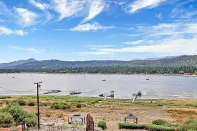 a view of a large lake with boats in it at North Shore Chalet by Big Bear Vacations Lakeside Fawnskin Estate Boat Dock Lake Access in Fawnskin