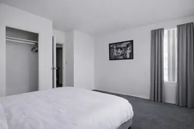 a white bedroom with a bed and a window at Spacious 2 Bedroom 2 Bathroom Unit Great Location in Los Angeles