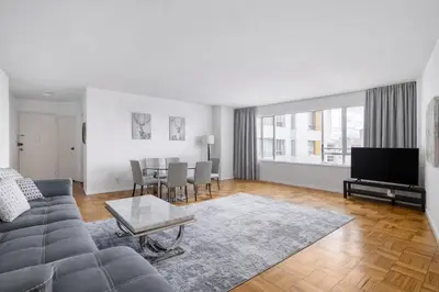 a living room with a couch and a table at Spacious 2 Bedroom 2 Bathroom Unit Great Location in Los Angeles