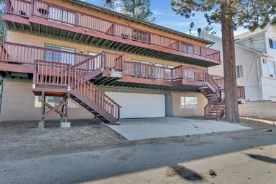 a house with two decks and a garage at Brownie's Den- Modern Cozy Central Resort Condo in Big Bear Lake