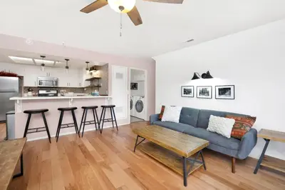 a living room with a couch and a table at Brownie's Den- Modern Cozy Central Resort Condo in Big Bear Lake