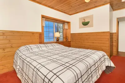 a bedroom with a bed and a window at Cozy Summit- Cozy Central Resort Chalet- Minutes to Activities in Big Bear Lake