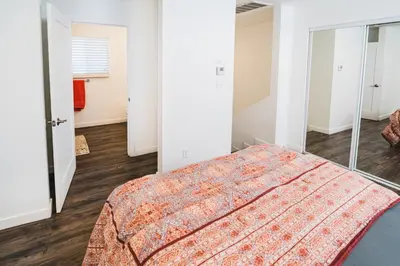 a bedroom with a bed and a mirror at Nice and Close to Downtown 1 Bedroom Sleeps 4 in Los Angeles