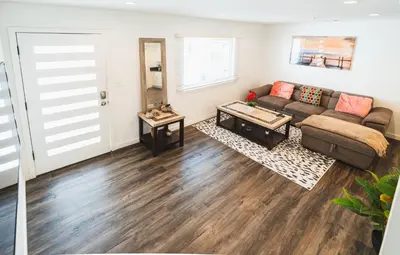 a living room with a couch and a table at Nice and Close to Downtown 1 Bedroom Sleeps 4 in Los Angeles