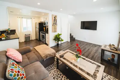 a living room with a couch and a table at Nice and Close to Downtown 1 Bedroom Sleeps 4 in Los Angeles