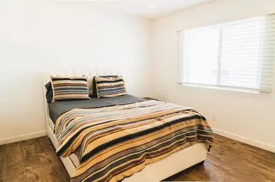 a bedroom with a bed and a window at Cozy Koreatown 1 Bedroom Modern Furnished Free Parking in Los Angeles
