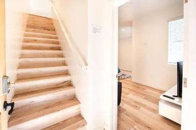 a staircase in a home with wooden floors at Hollywood 3Bedrooms Stylish Loft with 2 Parking in Los Angeles