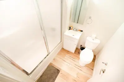 a bathroom with a shower and a toilet and a sink at Hollywood 3Bedrooms Stylish Loft with 2 Parking in Los Angeles