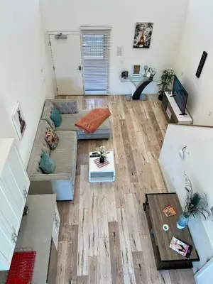 an overhead view of a living room with a couch at Modern One-Bed Loft in Hollywood Sign View & Free Parking in Los Angeles