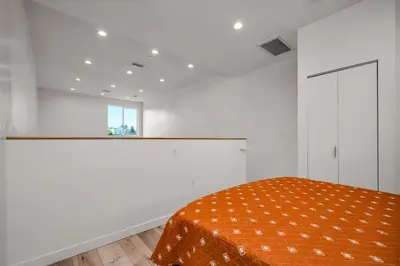 a white room with a bed and a window at New 1 Bedroom Loft with View of Hollywood Sign in Los Angeles