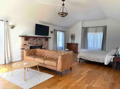 a living room with a couch and a fireplace at 30 PCT OFF! Malibu Romantic Suite, Ocean View, Beach in Malibu