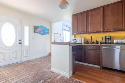 a kitchen with wooden cabinets and a counter top at 30 PCT OFF! Malibu Romantic Suite, Ocean View, Beach in Malibu