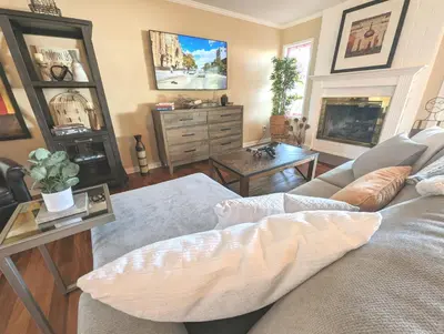a living room with a couch and a fireplace at 4 BR Encino Home w/ Amazing Yard, Near Everything in Encino