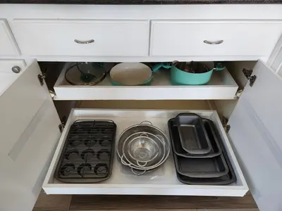 an open kitchen drawer with dishes and a plate at 4 BR Encino Home w/ Amazing Yard, Near Everything in Encino