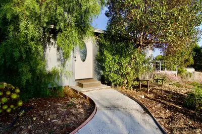 a house with a white door on the side of it at 30 PCT OFF! Malibu Charming Suite, Ocean View, King Bed in Malibu