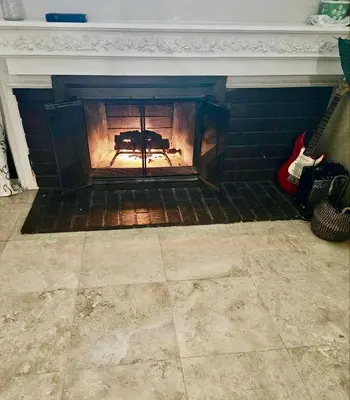 a fireplace with a fire inside of it at Buxton Private Room and Bath Wheel Chair Access in Rialto