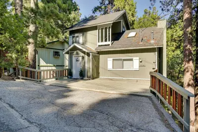 a house with a porch and a driveway at Peaceful Pines Running Springs Home with 3 Decks in Running Springs