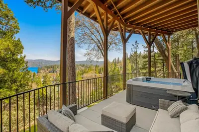 a hot tub on the deck of a house at Surreal Feel Lakeview Chalet in Lake Arrowhead