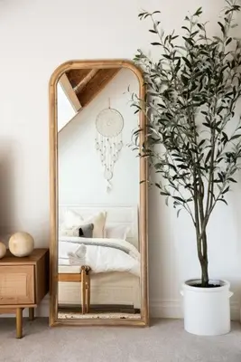 a mirror in a bedroom with a potted tree at Wild Olive Lodge ° Serene grandma chíc getaway cabin in Running Springs