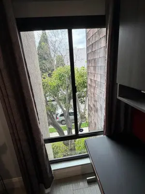 a window in a room with a view of a street at Updated Gorgeous studio condo in West Hollywood with Pool in Los Angeles