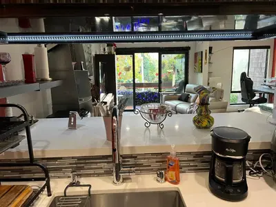 a kitchen with a sink and a counter top at Updated Gorgeous studio condo in West Hollywood with Pool in Los Angeles