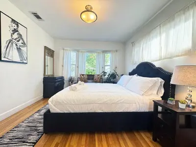a bedroom with a large bed and a window at Charming 3BR House - Hal-UC in Los Angeles