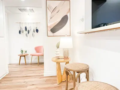 a living room with two chairs and a table with a lamp at Hollywood Habitat - BR11-WH in Los Angeles