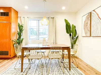 a dining room with a table and chairs at Hollywood Habitat - BR11-WH in Los Angeles