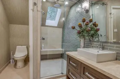a bathroom with a sink and a toilet and a shower at Lake Front Modern Luxury in Lake Arrowhead