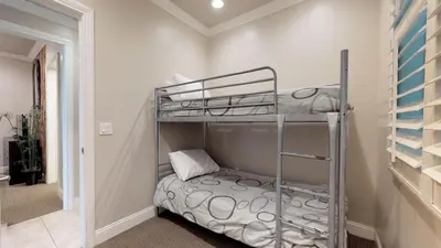 a bedroom with a bunk bed in a room at 3 Bedroom 2 Bath Beachfront Home in Huntington Beach