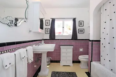 a bathroom with a sink and a toilet at Charming Pasadena English Cottage on Tree Lined Street in Pasadena