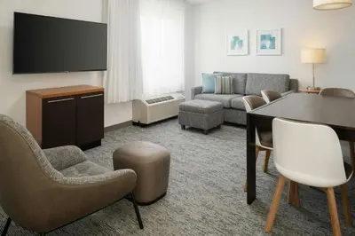 a living room with a couch and a table at TownePlace Suites by Marriott Lancaster in Lancaster