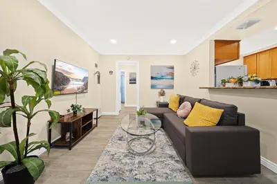 a living room with a couch and a table at Cozy & Serene ~ 12mins to Downtown LA in Alhambra