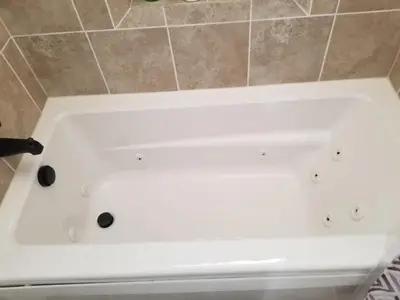 a white bath tub in a bathroom with a knife at Lake Isabella View, Wofford Heights, Kern County in Wofford Heights