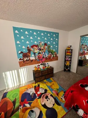 a bedroom with a mickey mouse mural on the wall at Mario, Disney & not themed Loft Universal Studios 10min loft apartment in Los Angeles