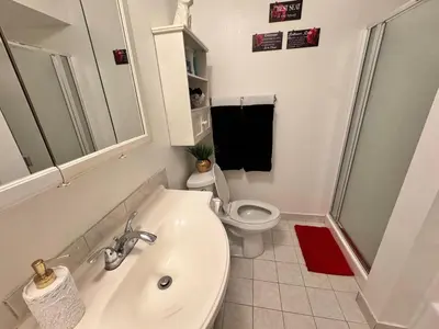 a bathroom with a white sink and a toilet at Mario, Disney & not themed Loft Universal Studios 10min loft apartment in Los Angeles
