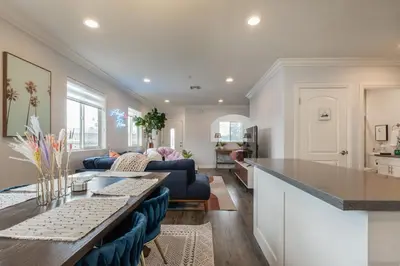 a kitchen and living room with a couch and a table at Angel & Rose * Hollywood DTLA in Los Angeles