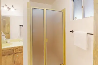 a bathroom with a shower and a sink at Rocky Pines in Twin Peaks
