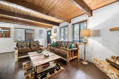a living room with two couches and a table at Bear PAC Hideout - Walk to Alpine Slide and only minuetes to The Village! Billiards and foosball! in Big Bear Lake