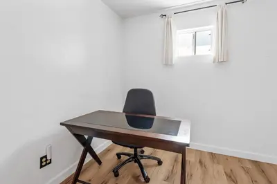 a desk and a chair in a room with a window at Boulder Bay Lakefront Getaway - Across the street from the lake and Boulder Bay Park! in Big Bear Lake