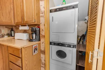 a washer and dryer in a small kitchen at Boulder Pines - Walk to lake and Boulder Bay park at those cozy location! in Big Bear Lake