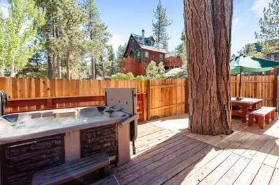 a backyard with a grill and a tree at Boulder Pines - Walk to lake and Boulder Bay park at those cozy location! in Big Bear Lake