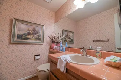 a bathroom with a sink and a toilet at Lakefront Viking Oasis - Beautiful Viking Estates condo complex on the lake! in Big Bear Lake