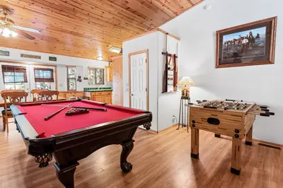 a living room with a pool table and a desk at McWhinney The Pooh's Den - Everything you need for a memorable time with family! Pool Table! in Big Bear Lake