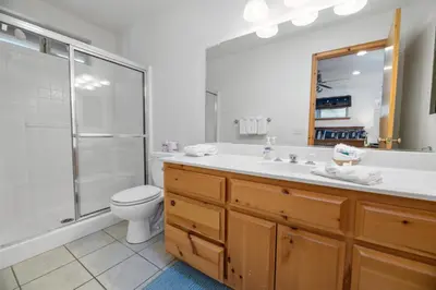 a bathroom with a toilet and a sink and a shower at Treetop Bearadise - Best mountain living in a nicely furnished and decorated home in Big Bear Lake